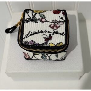 Dior Mini Pouch crafted from embroidered canvas
